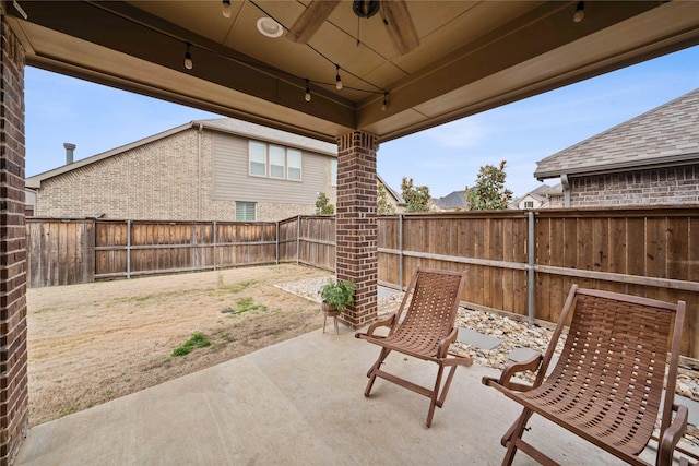 view of patio / terrace with ceiling fan and a fenced backyard