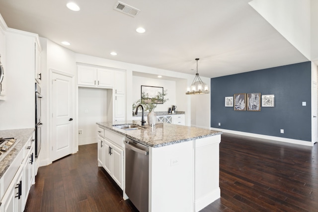 kitchen with sink, white cabinetry, a kitchen island with sink, and appliances with stainless steel finishes