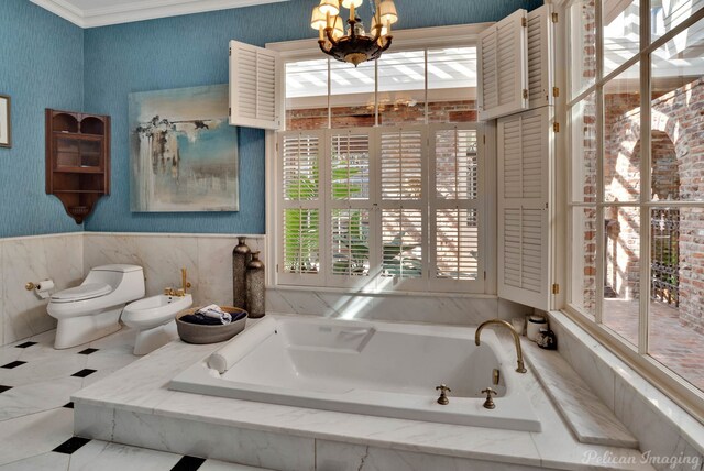 bathroom with a bidet, crown molding, toilet, tiled bath, and a chandelier