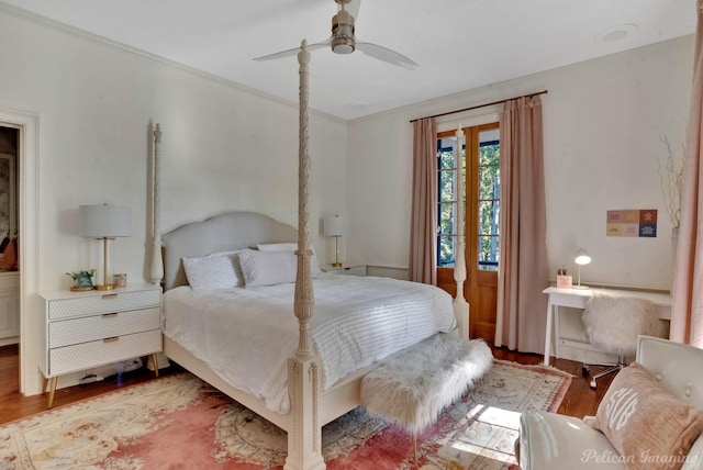 bedroom with ceiling fan, hardwood / wood-style floors, and crown molding