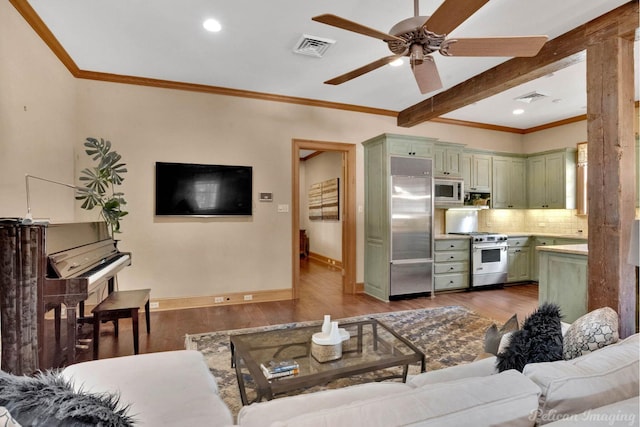 living room featuring ceiling fan, crown molding, beamed ceiling, and hardwood / wood-style flooring