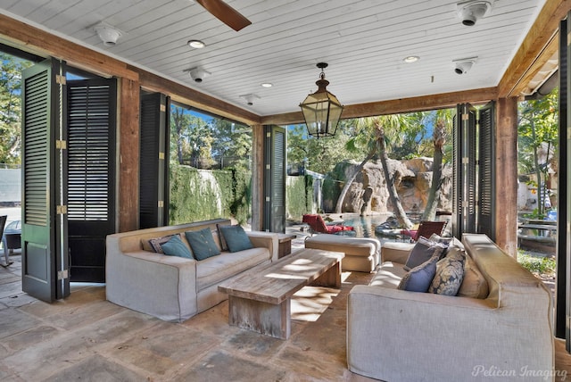 sunroom / solarium featuring wooden ceiling