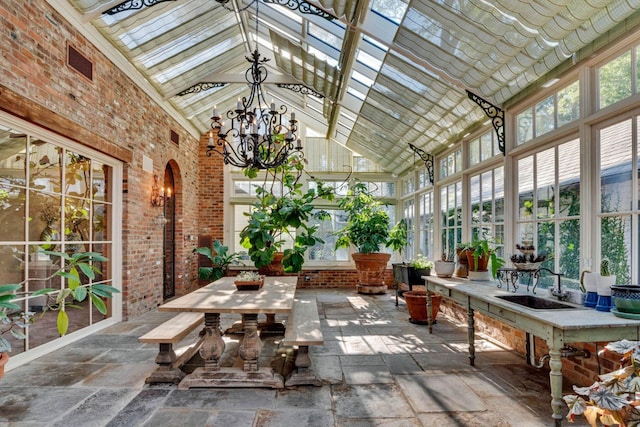 unfurnished sunroom with a chandelier and lofted ceiling