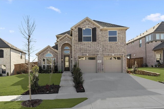 view of front facade with a garage and a front lawn