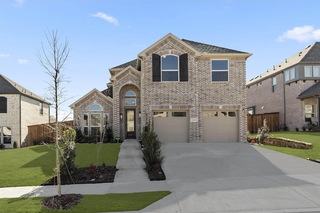 view of front facade with a front lawn and a garage