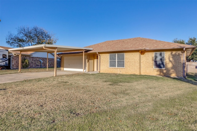 ranch-style home with a garage, a front yard, and a carport