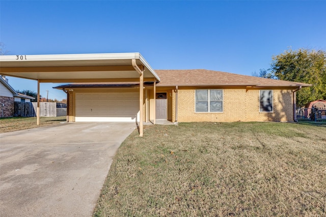 ranch-style home featuring a front yard, a garage, and a carport