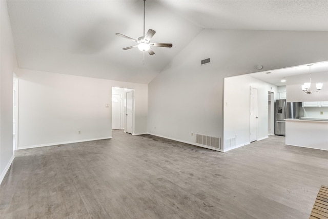 unfurnished living room with hardwood / wood-style flooring, ceiling fan with notable chandelier, and high vaulted ceiling