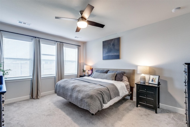 bedroom with light colored carpet and ceiling fan