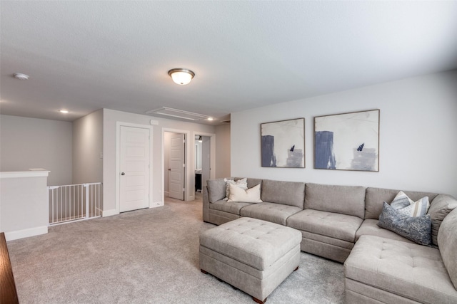 living room with light colored carpet and a textured ceiling