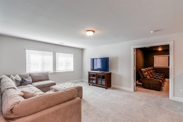 carpeted living room with a textured ceiling