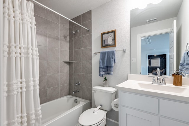 full bathroom featuring shower / bath combo, vanity, and toilet