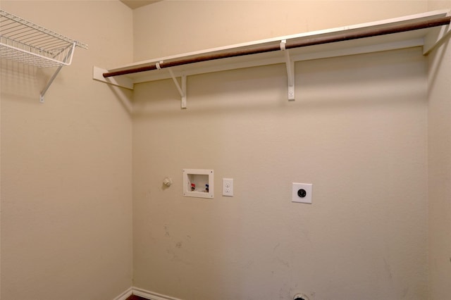 clothes washing area with electric dryer hookup, washer hookup, and hookup for a gas dryer