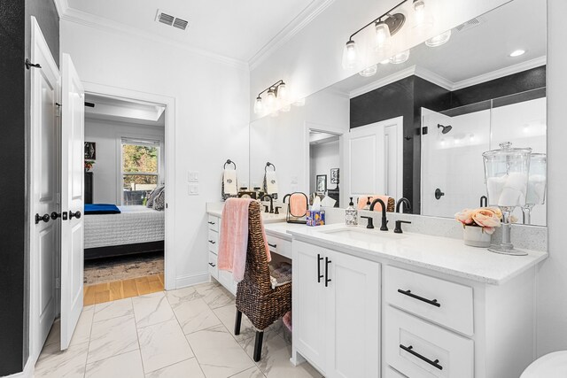 bathroom with vanity, hardwood / wood-style flooring, an enclosed shower, and ornamental molding