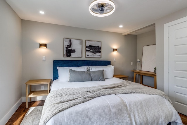 bedroom with dark hardwood / wood-style flooring