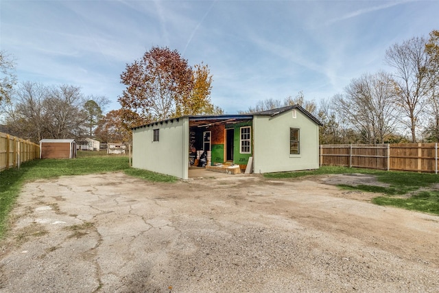 exterior space featuring a storage unit