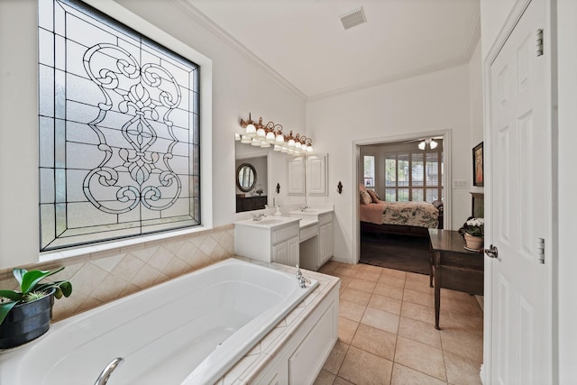 bathroom featuring tile patterned flooring, vanity, ornamental molding, and tiled tub