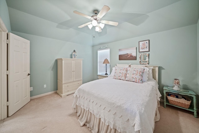 carpeted bedroom featuring ceiling fan and lofted ceiling