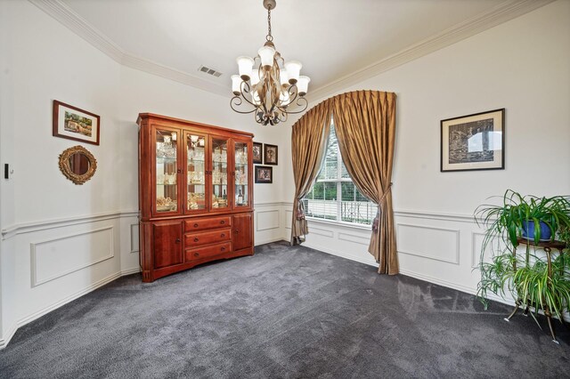 unfurnished dining area with ornamental molding, a notable chandelier, and dark colored carpet