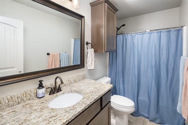 bathroom with tile patterned flooring, vanity, curtained shower, and toilet