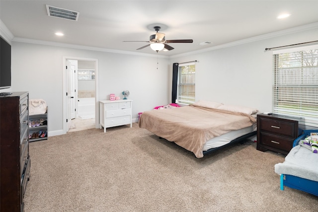 carpeted bedroom with ceiling fan, ornamental molding, and multiple windows