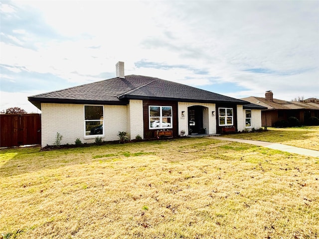 ranch-style home with a front yard