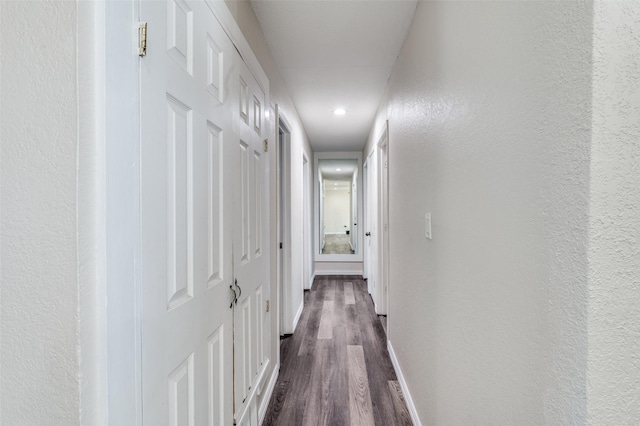 corridor featuring dark hardwood / wood-style flooring