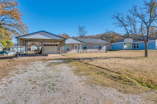 ranch-style house featuring a front lawn, a garage, and a carport