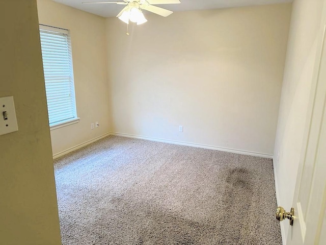 carpeted empty room with ceiling fan