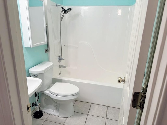 bathroom featuring tile patterned floors, shower / tub combination, and toilet