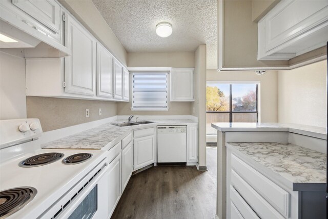 kitchen with dark hardwood / wood-style flooring, a textured ceiling, white appliances, sink, and white cabinets