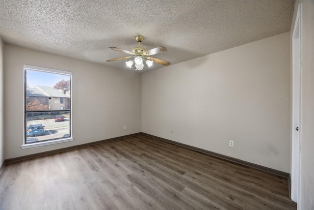 unfurnished room with hardwood / wood-style flooring, ceiling fan, and a textured ceiling