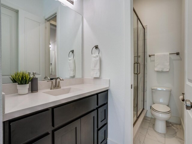 full bathroom featuring vanity, shower / bath combination with curtain, and toilet