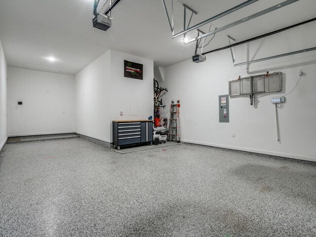 garage featuring a garage door opener and electric panel