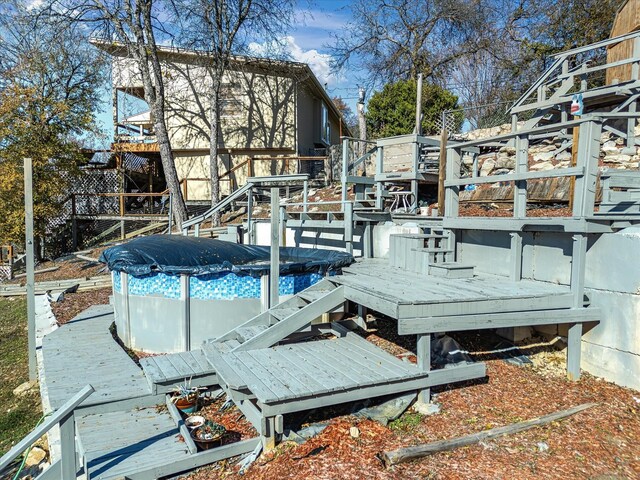 view of dock with a pool side deck