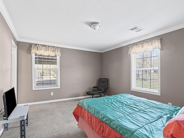 bedroom featuring a textured ceiling, carpet floors, and ornamental molding