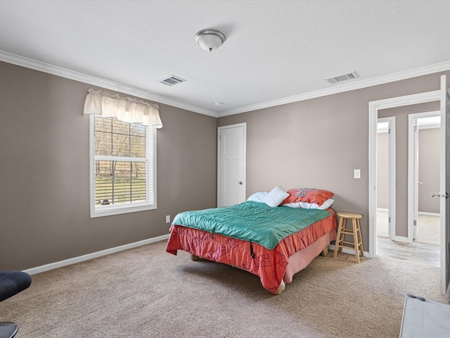 carpeted bedroom with crown molding and a textured ceiling