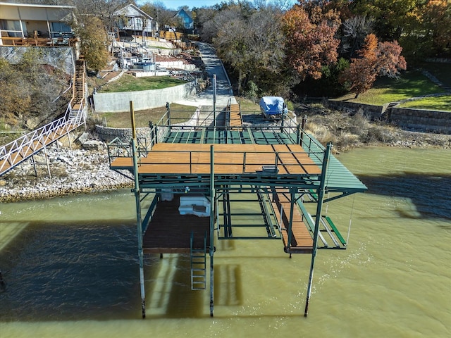 view of home's community with a water view and a boat dock