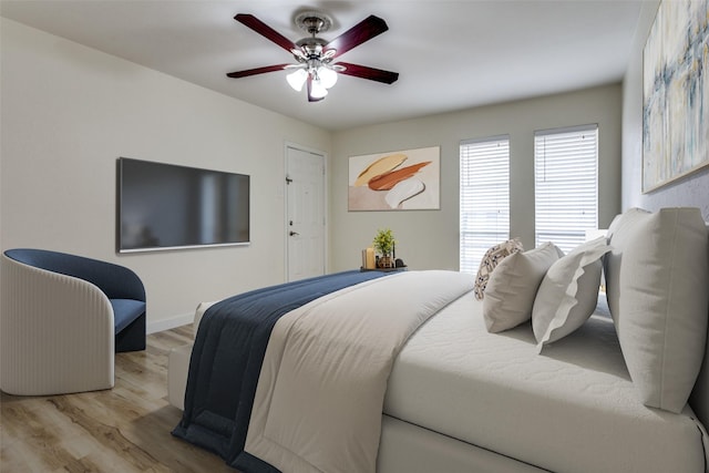 bedroom featuring ceiling fan and light wood-type flooring