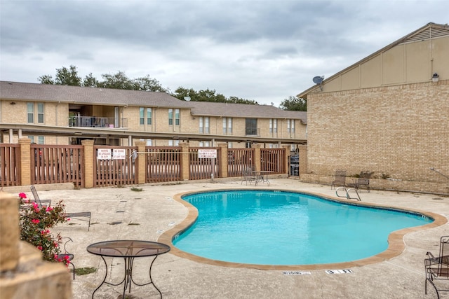 view of pool featuring a patio area