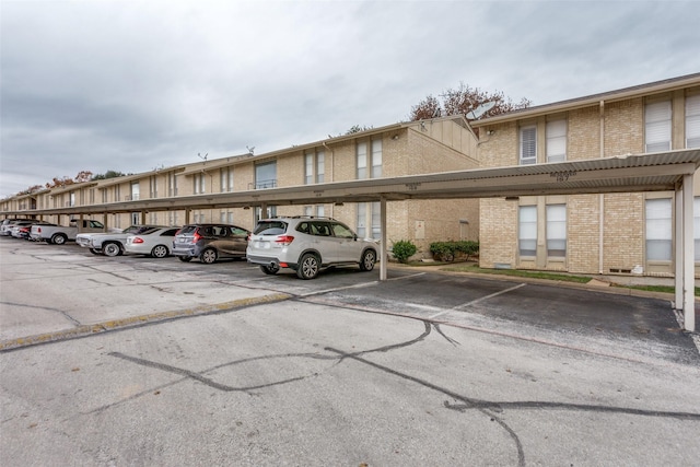 view of parking / parking lot with a carport