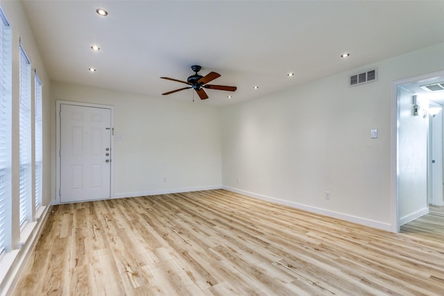 unfurnished room featuring ceiling fan and light wood-type flooring