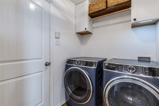 laundry room with cabinets and separate washer and dryer