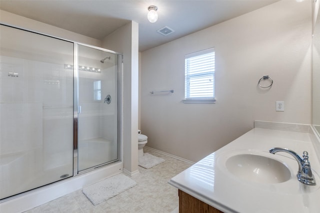 bathroom featuring toilet, walk in shower, and vanity