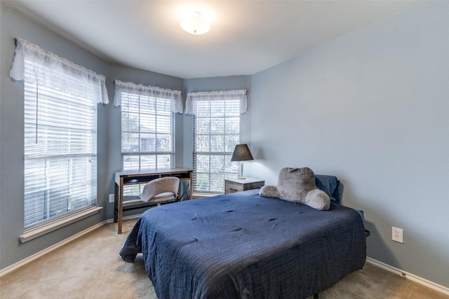 bedroom with light colored carpet