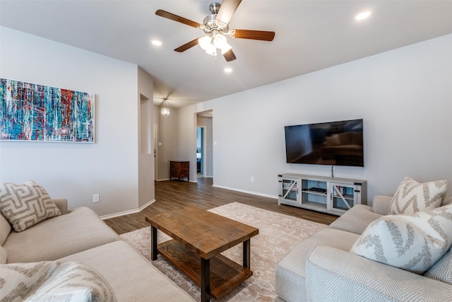 living room with hardwood / wood-style flooring and ceiling fan