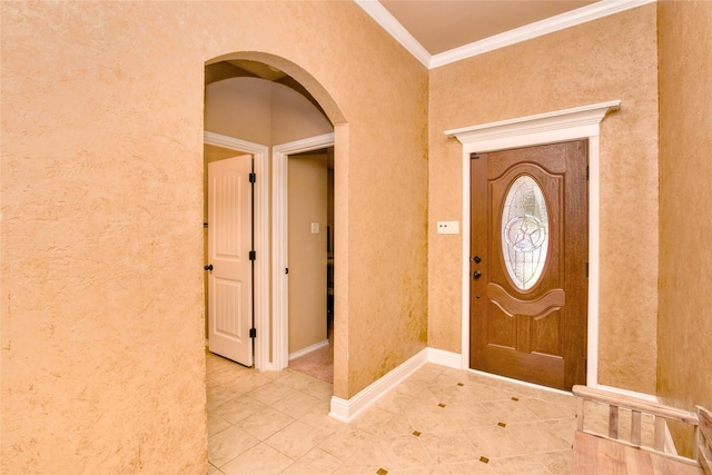 tiled entrance foyer with crown molding