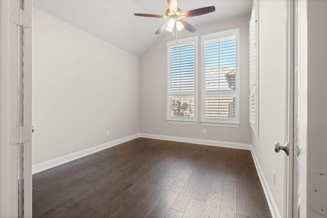 interior space with ceiling fan, dark wood-type flooring, and vaulted ceiling