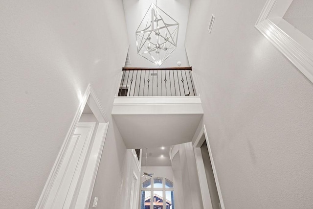 stairway with a towering ceiling