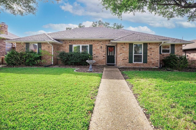 single story home featuring a front yard